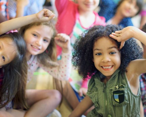 Happy diverse young school kids